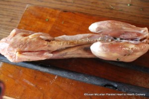 After the rabbit's belly is stuffed with the whisked egg mixed with chopped parsley for the receipt (recipe) To Roast a Rabbit sew the belly closed with linen twine.  The rabbit is now ready for the spit.