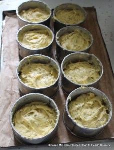 After the tincture of saffron was added to the ingredients for the receipt (recipe) Nun's Cake butter the hoops and put it in. There were two tin baking sheets lined with buttered paper readied for the bake oven.