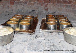 After the batter for the receipt (recipe) Nun's Cake has been put in the buttered hoops on tin baking sheets lined with buttered paper, the sheets were placed in the bake oven until done.