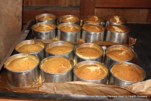 After the aroma of the receipt (recipe) Nun's Cake wafted through the kitchen, the sixteen tinned cake hoops on the paper lined tin baking sheets were removed from the oven.  They will sit for a short time and then the hoops will be removed.