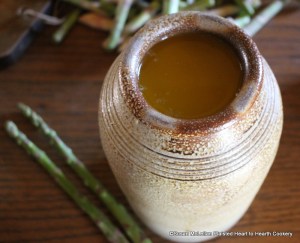 After the napkin is placed over the asparagus, salt, cloves and sliced lemon for the receipt (recipe) To preserve Asparagus cover it with melted Butter to keep them.