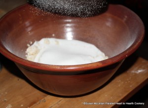 After a half a pound of blanched almonds were beaten very fine with orange flower water for the receipt (recipe) Orange Cheese-cakes with a Past for Them take half a pound of fine suger, beat and sifted.  I love this picture as it captures the sugar falling into the bowl from the sifter.