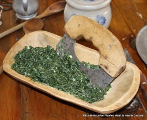 After the water has been squeezed from the stewed spinach and butter added for the receipt (recipe) To make Spinach Toasts chop it small.  A rocker knife was used for this step.