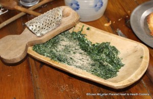 After the stewed spinach had been chopped small for the receipt (recipe) To make Spinach Toasts put in a little nutmeg.  Some nutmeg was grated on the spinach that was chopped.