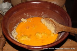 After the melted butter has been cooled and added to the finely beaten almonds and sugar for the receipt (recipe) Orange Cheese-cakes with a Past for them add the yolks of twelve eggs and the whites of four.