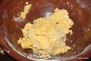 After the flour and sugar have been worked with hands into the butter for the receipt (recipe) Orange Cheese-cakes with a Past for Them worke it together with the yolks of three eggs and the whites of two.