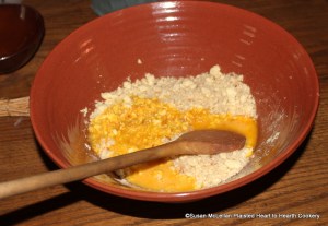 After an equal amount of grated bread has been added to the crumbled cheese curd for the receipt (recipe) Cheese Loaves take yolks of eggs.  In order to achieve a good consistency, it took five yolks of eggs.  First adding two yolks and then adding one yolk at a time for the amount of cheese and bread.