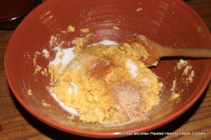 After the yolks of eggs have been added to the fresh cheese and grated bread for the receipt (recipe) Cheese Loaves take Mace, Nutmeg and sweeten to your Taste with Sugar.