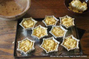 After all the ingredients for the receipt (recipe) Cheese Loaves has been mixed together then take some stone porringers, butter them and put in the Curd.  I had stone-ware patty pans and not stone porringers so used my patty pans.