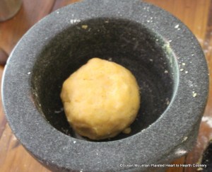 After the parmesan cheese, flour, powdered bisket bread, egg yolks, saffron, rose water, sugar, cloves and cream have been added to the marble mortar for the receipt (recipe) Fritters in the Italian Fashion make it into a stiff paste.