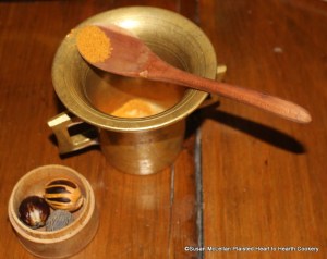 After some cloves have been added to the mortar for the receipt (recipe) Fritters in the Italian Fashion take some mace.  Mace is the webbing (aril) that wraps the seed coating of nutmeg.  