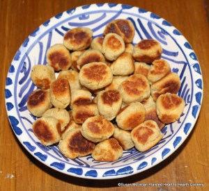 The receipt (recipe) for Fritters in the Italian Fashion, R. May, 1685:  Take a pound of parmisan grated, a pint of fine flower, and as much bisket bread beaten to powder, the yolks of four or five eggs, some saffron, and rose water, sugar, cloves, mace and cream, make it into a stiff paste, then make it into balls, and fry them in clarified butter.  Make the balls as big as a nutmeg or musket bullet.