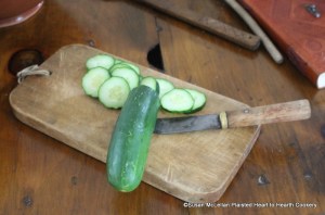 The first step in the preparation of the receipt (recipe) To stew Cucumbers is to take six large Cucumbers, slice them.  As the receipt did not specify peeling the cucumbers but did the onions, I left the peel on.