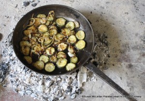After butter has been heated to sizzling in the cast iron pan for the receipt (recipe) To stew Cucumbers fry them both brown. The sliced cucumbers with peel and onions were mixed together and fried to all were browned.