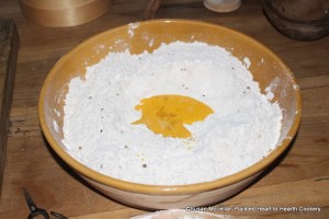 After the flour, cinnamon, coriander seeds and anise seeds have been mixed together for the receipt (recipe) To make Cinamon Bisket add 3 eggs whisked. I am preparing one third of the receipt so what is pictured is one egg whisked.